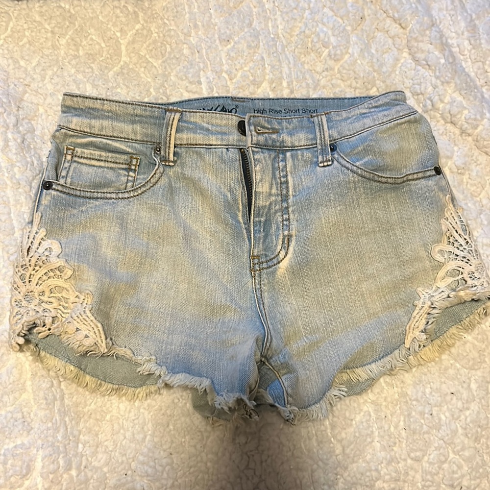 Denim shorts with lace details. Very flattering!